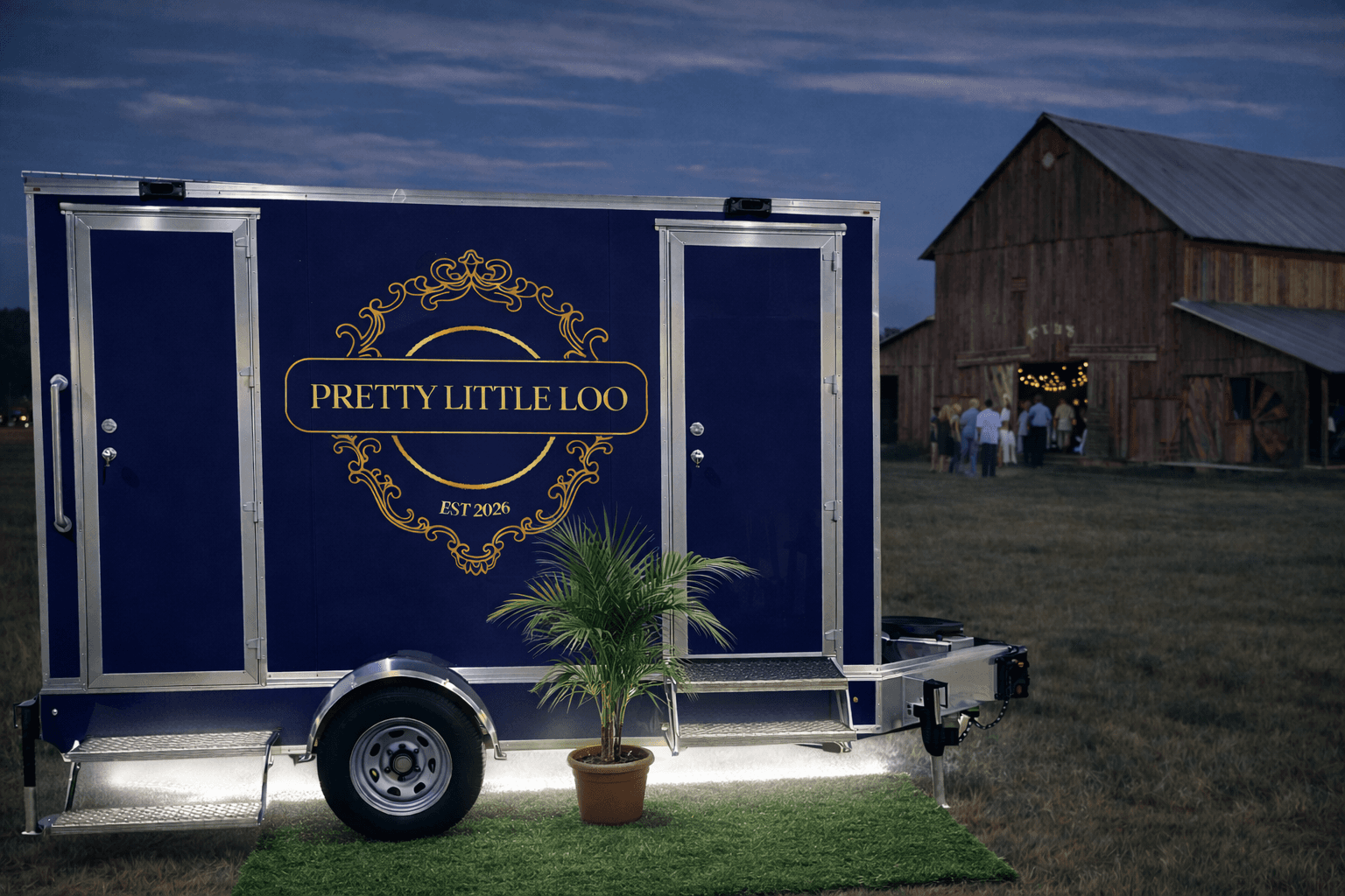 Pretty Little Loo luxury restroom trailer at a barn wedding venue at dusk