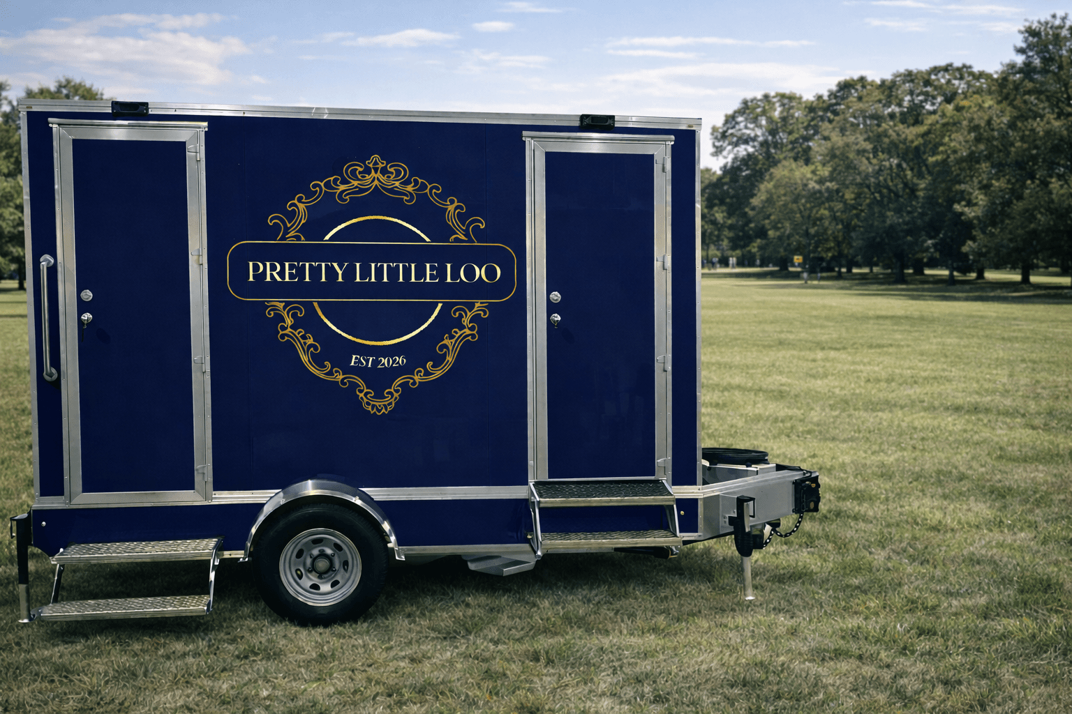 Pretty Little Loo luxury restroom trailer in a beautiful park setting